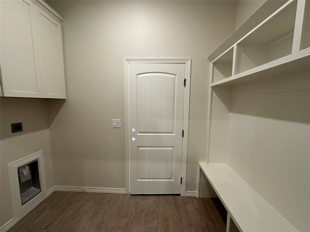 130 Lasso Loop Lorena, TX 76655 - Photo 13 of 14 a view of an empty room with wooden floor and a window