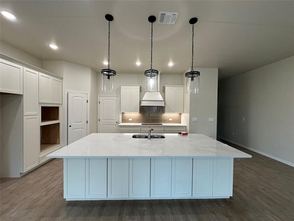 130 Lasso Loop Lorena, TX 76655 - Photo 2 of 14 a large kitchen with stainless steel appliances a large counter top a stove a sink and a refrigerator