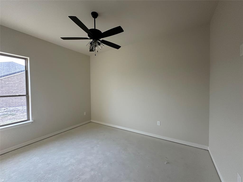 130 Lasso Loop Lorena, TX 76655 - Photo 7 of 14 an empty room with a window and a fan