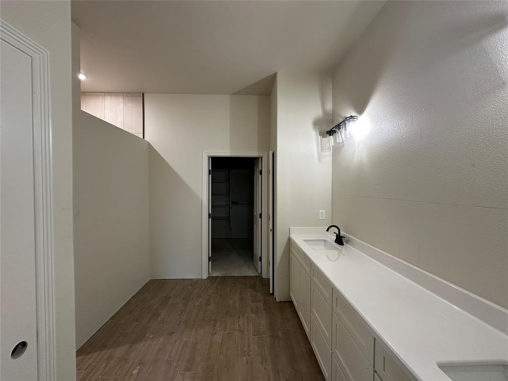 130 Lasso Loop Lorena, TX 76655 - Photo 9 of 14 a bathroom with a double vanity sink and mirror with shower