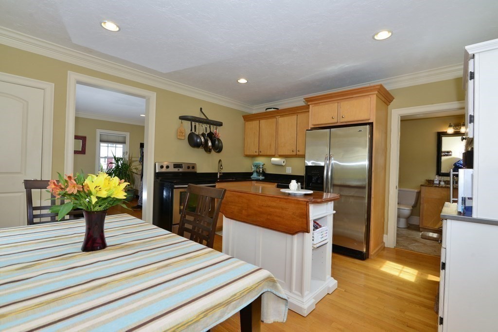 9 Ray Avenue Bellingham, MA 02019 - Photo 11 of 32 a kitchen with refrigerator and window