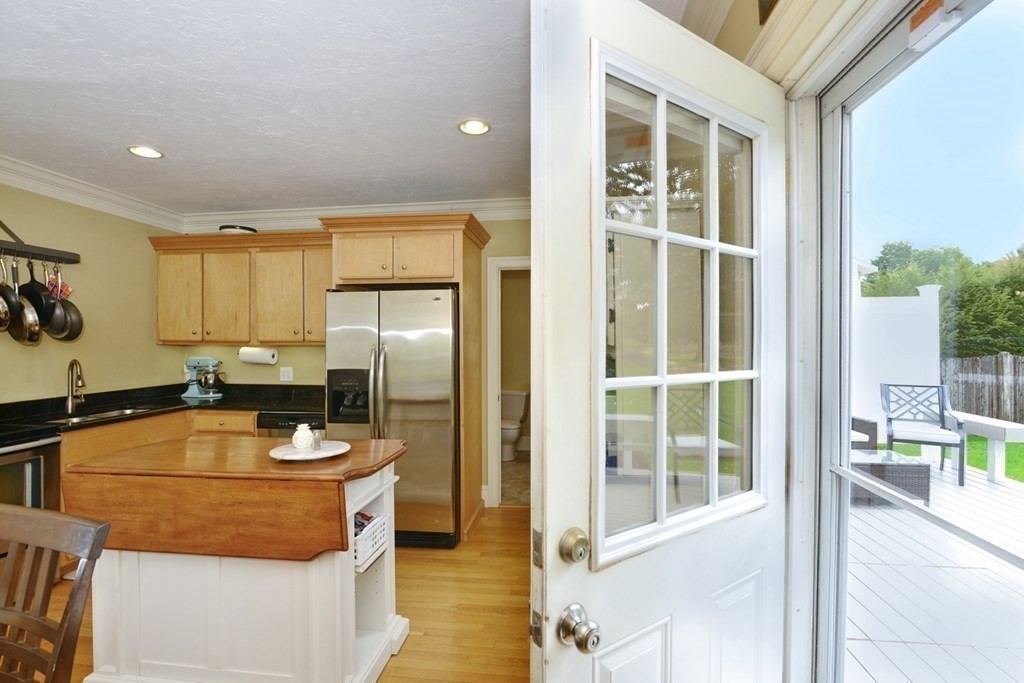 9 Ray Avenue Bellingham, MA 02019 - Photo 13 of 32 a room with furniture a window and flat screen tv