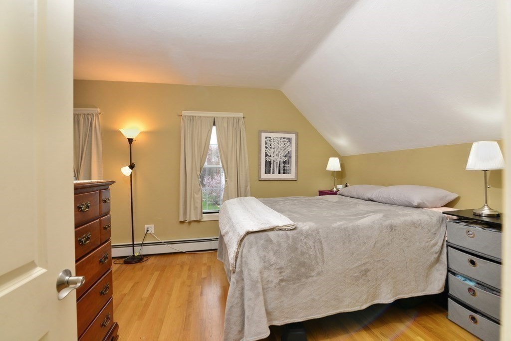 9 Ray Avenue Bellingham, MA 02019 - Photo 16 of 32 a bedroom with a bed and a lamp