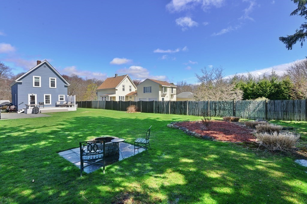 9 Ray Avenue Bellingham, MA 02019 - Photo 27 of 32 a front view of a house with garden