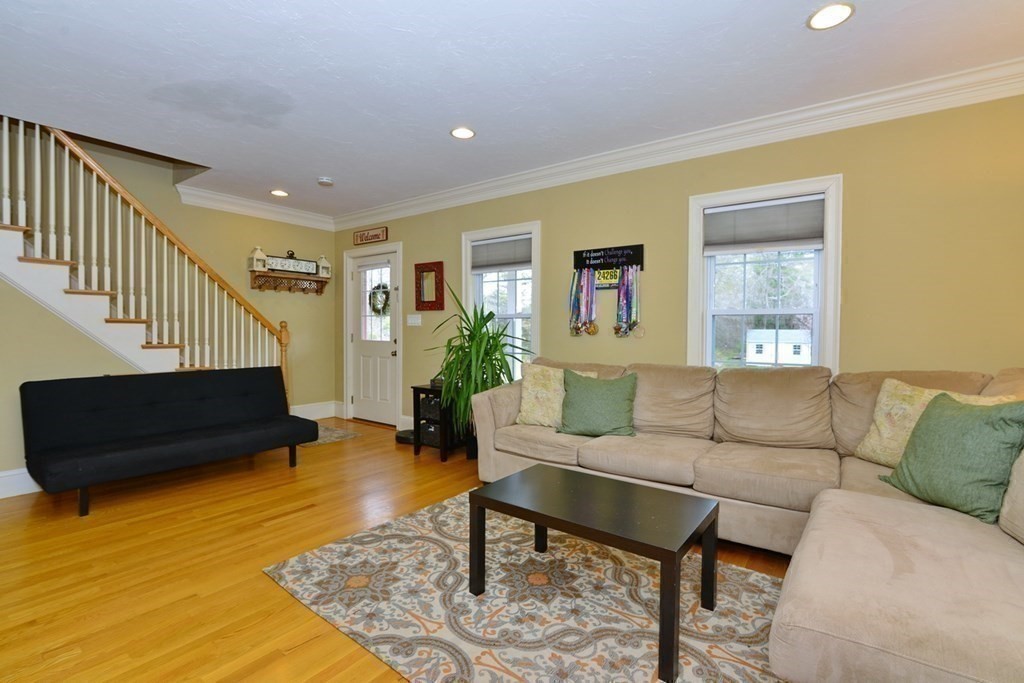 9 Ray Avenue Bellingham, MA 02019 - Photo 3 of 32 a living room with furniture and a rug