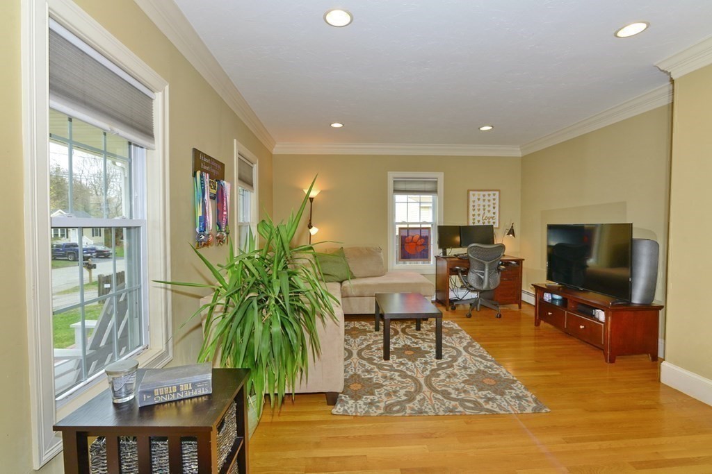 9 Ray Avenue Bellingham, MA 02019 - Photo 4 of 32 a living room with furniture and a flat screen tv
