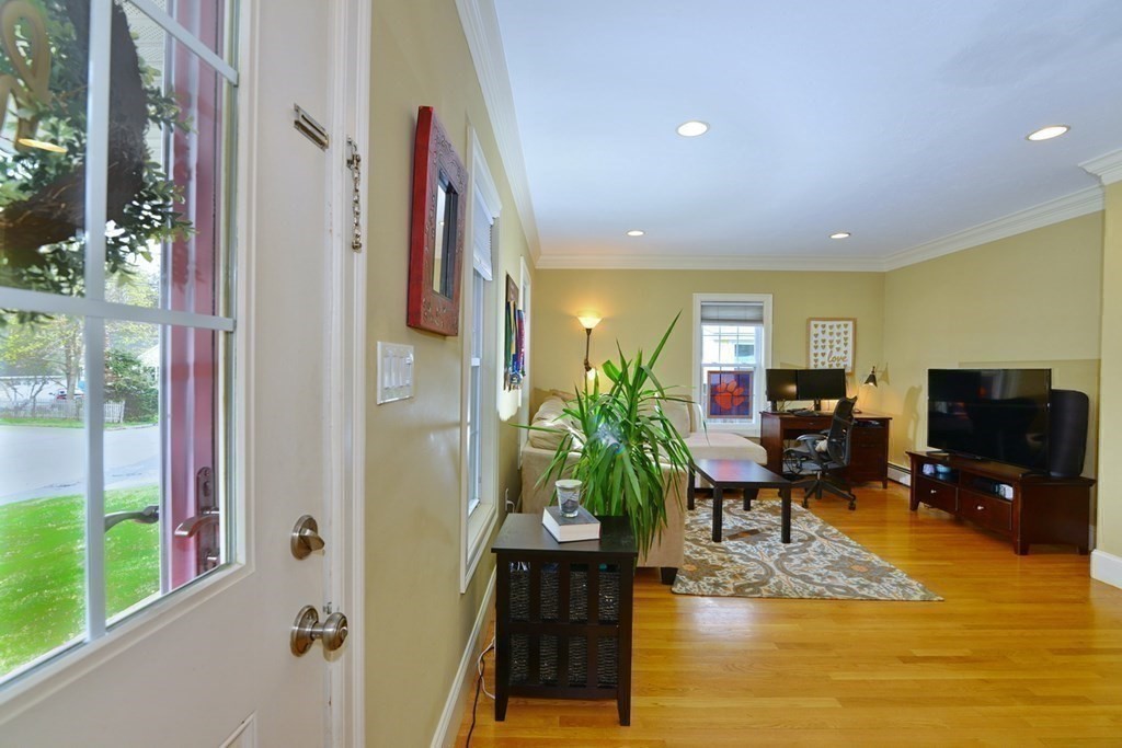 9 Ray Avenue Bellingham, MA 02019 - Photo 5 of 32 a living room with furniture wooden floor and a flat screen tv