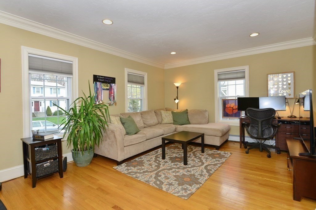 9 Ray Avenue Bellingham, MA 02019 - Photo 6 of 32 a living room with furniture and a wooden floor