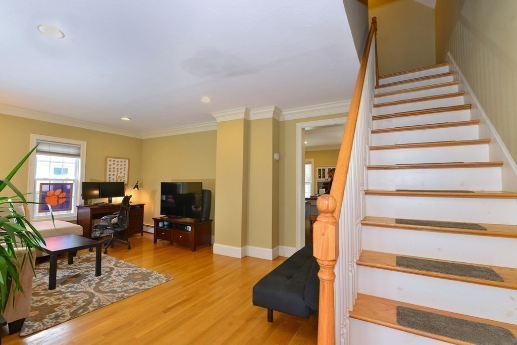 9 Ray Avenue Bellingham, MA 02019 - Photo 7 of 32 a living room with furniture and wooden floor