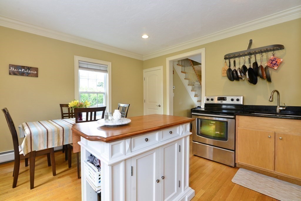 9 Ray Avenue Bellingham, MA 02019 - Photo 9 of 32 a kitchen with a stove and a refrigerator