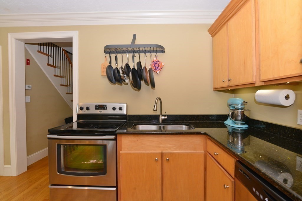9 Ray Avenue Bellingham, MA 02019 - Photo 10 of 32 a kitchen with a stove and a sink