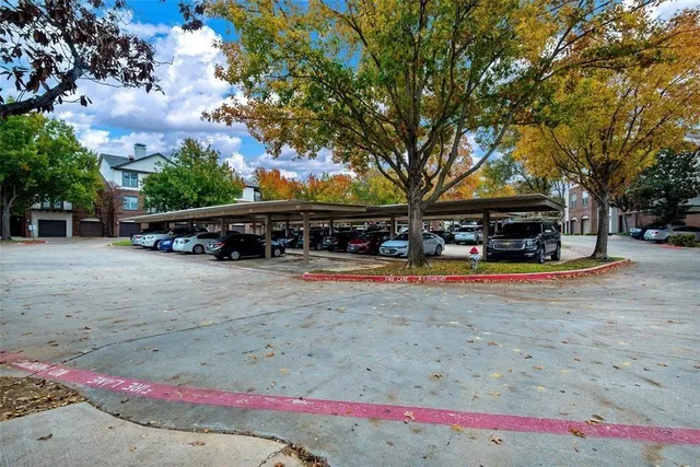 a front view of a building with trees