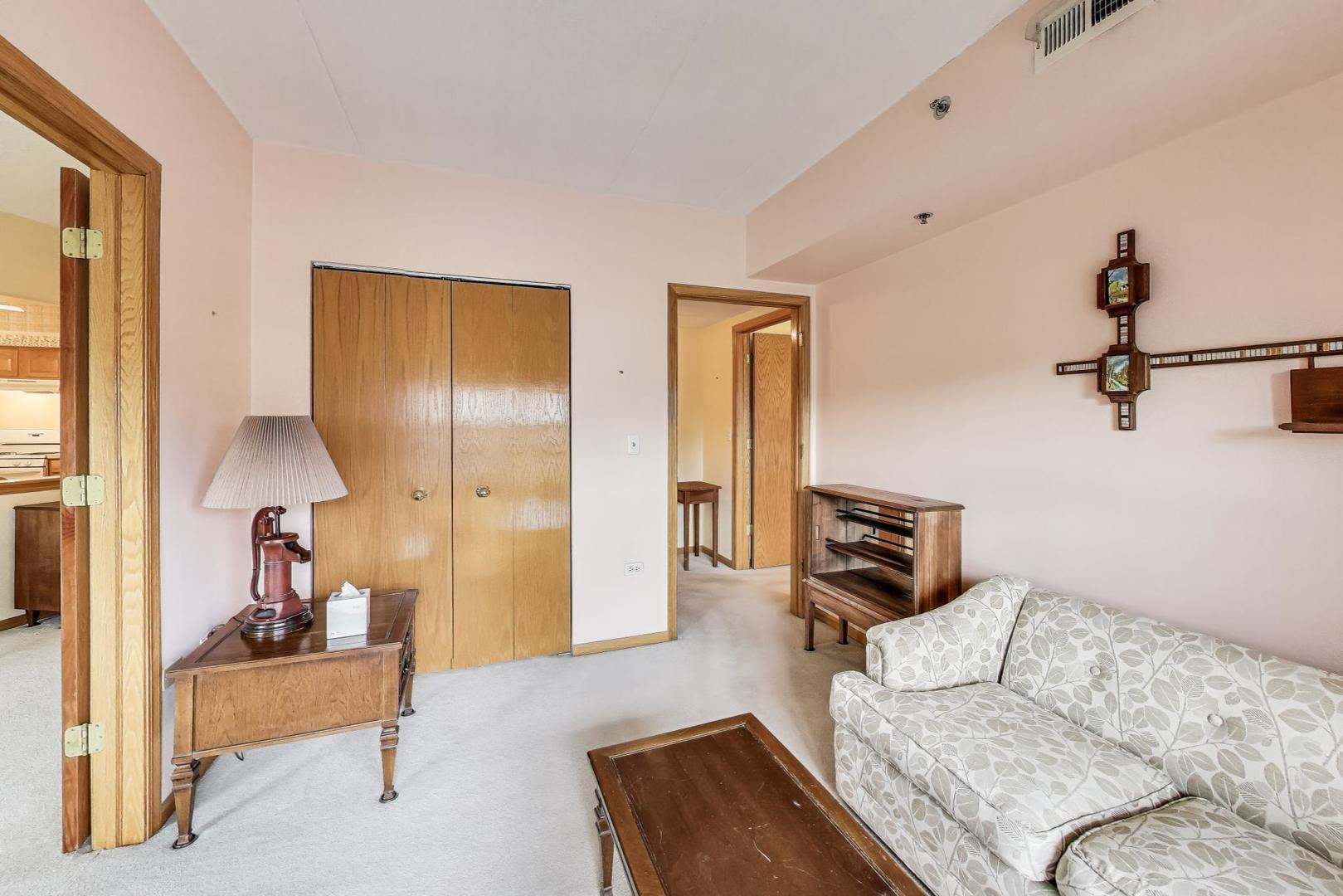 1200 South Prospect Avenue, Unit 108 Elmhurst, IL 60126 - Photo 10 of 19 a living room with furniture