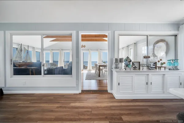 a kitchen with refrigerator and cabinets