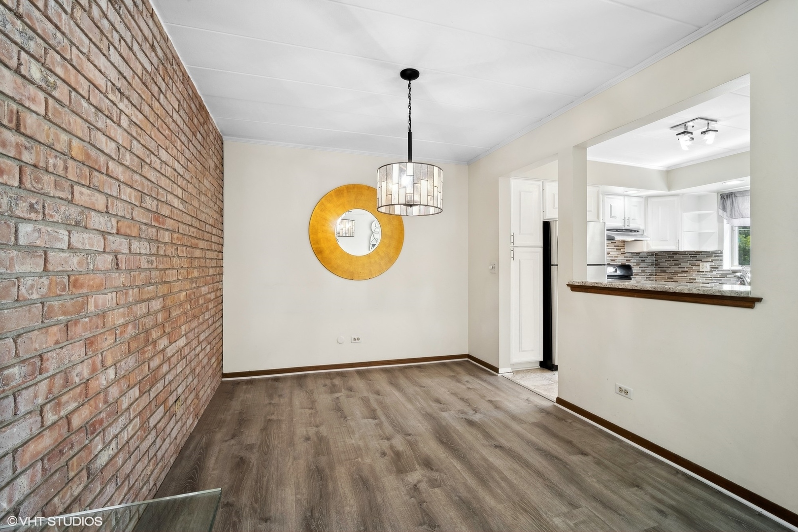 2 North Dee Road, Unit 103 Park Ridge, IL 60068 - Photo 12 of 30 an empty room with wooden floor and windows