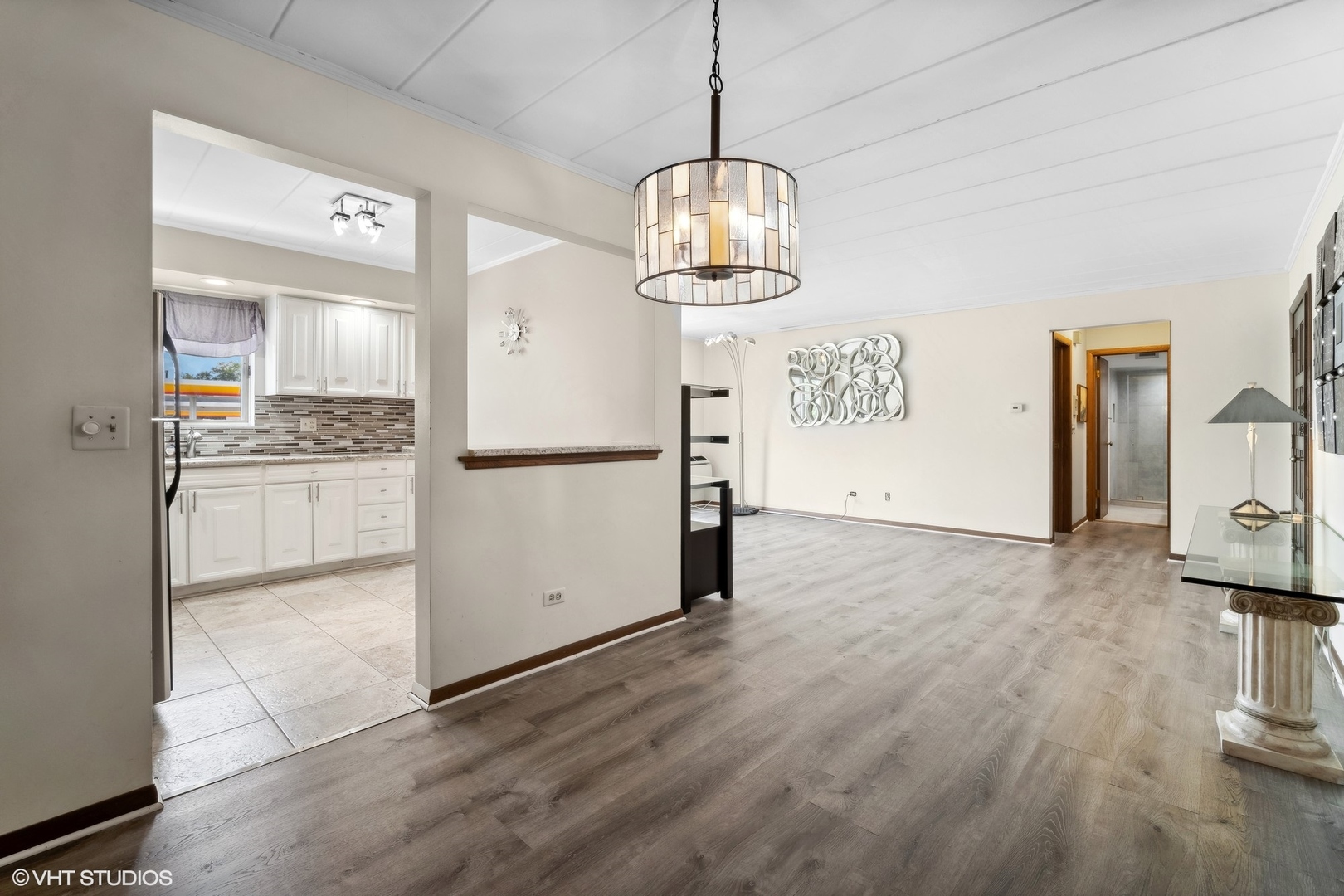 2 North Dee Road, Unit 103 Park Ridge, IL 60068 - Photo 13 of 30 a kitchen with stainless steel appliances granite countertop a refrigerator and a stove top oven