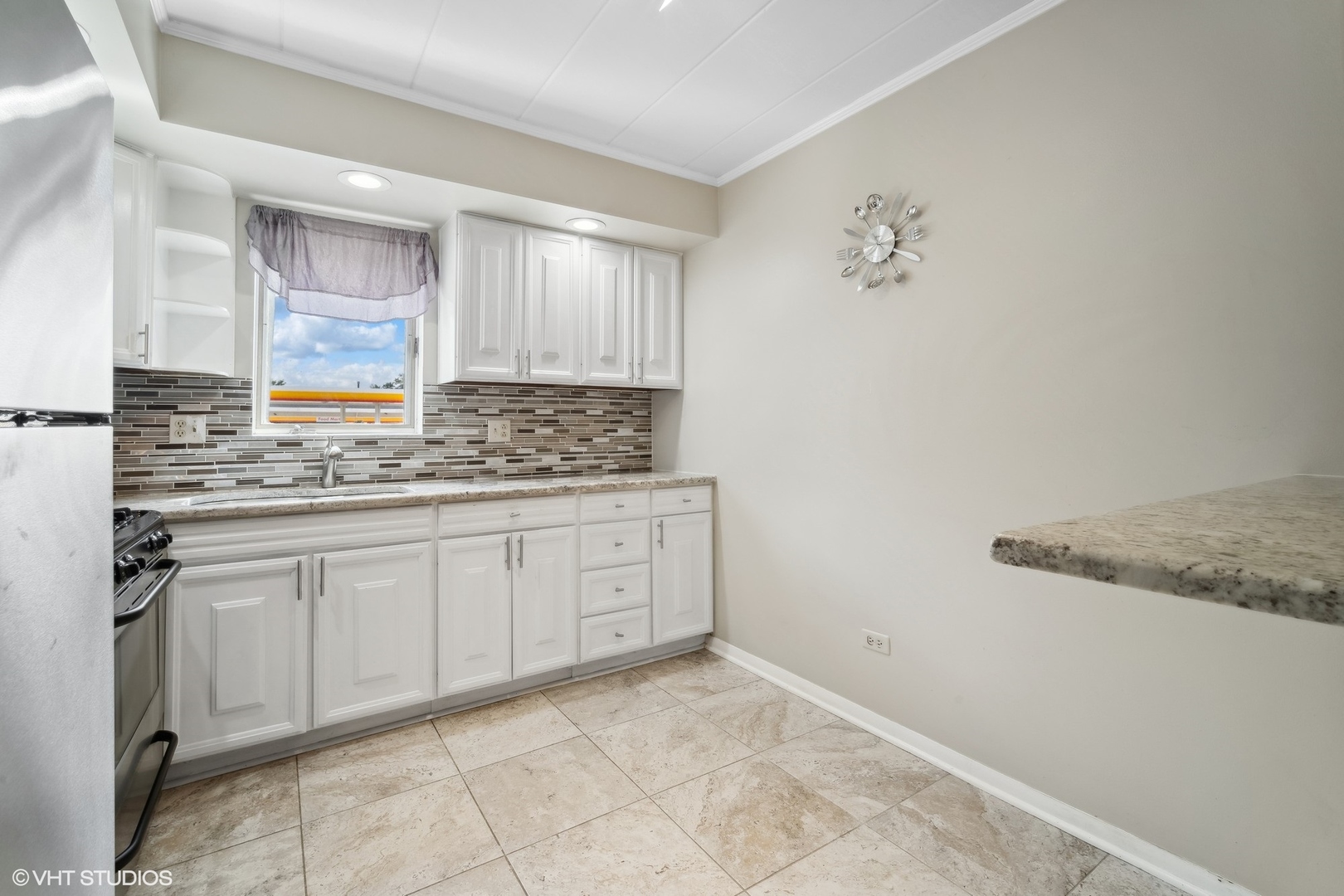 2 North Dee Road, Unit 103 Park Ridge, IL 60068 - Photo 14 of 30 a kitchen with a sink cabinets and window