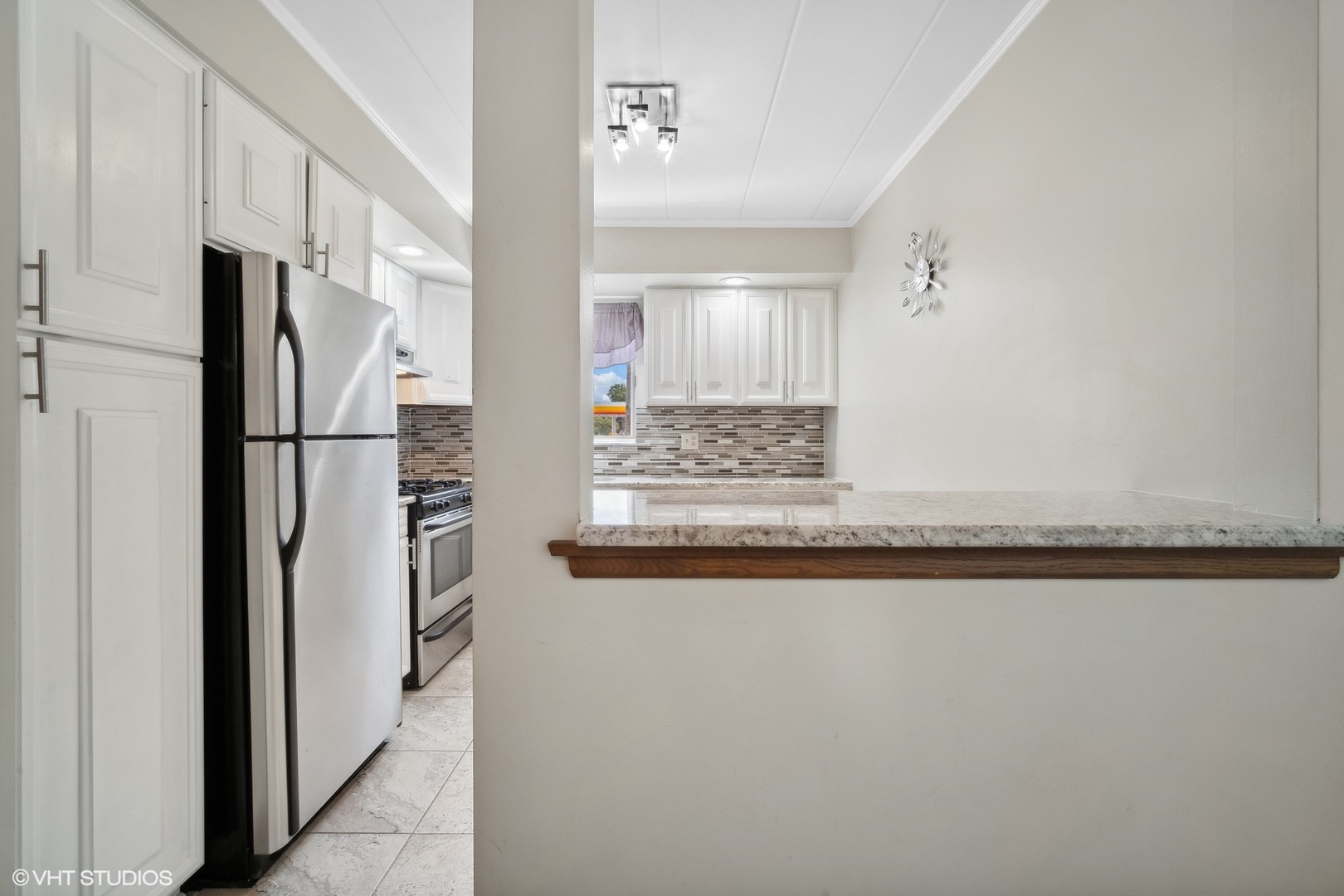 2 North Dee Road, Unit 103 Park Ridge, IL 60068 - Photo 15 of 30 a view of a kitchen with refrigerator and windows