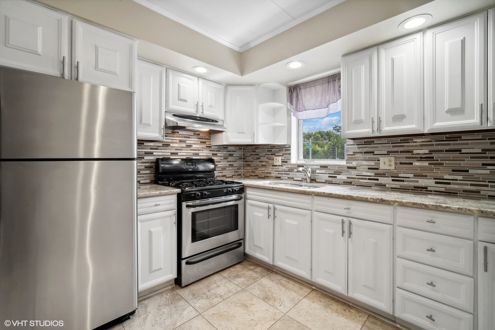 2 North Dee Road, Unit 103 Park Ridge, IL 60068 - Photo 16 of 30 a kitchen with appliances a sink and lots of cabinets