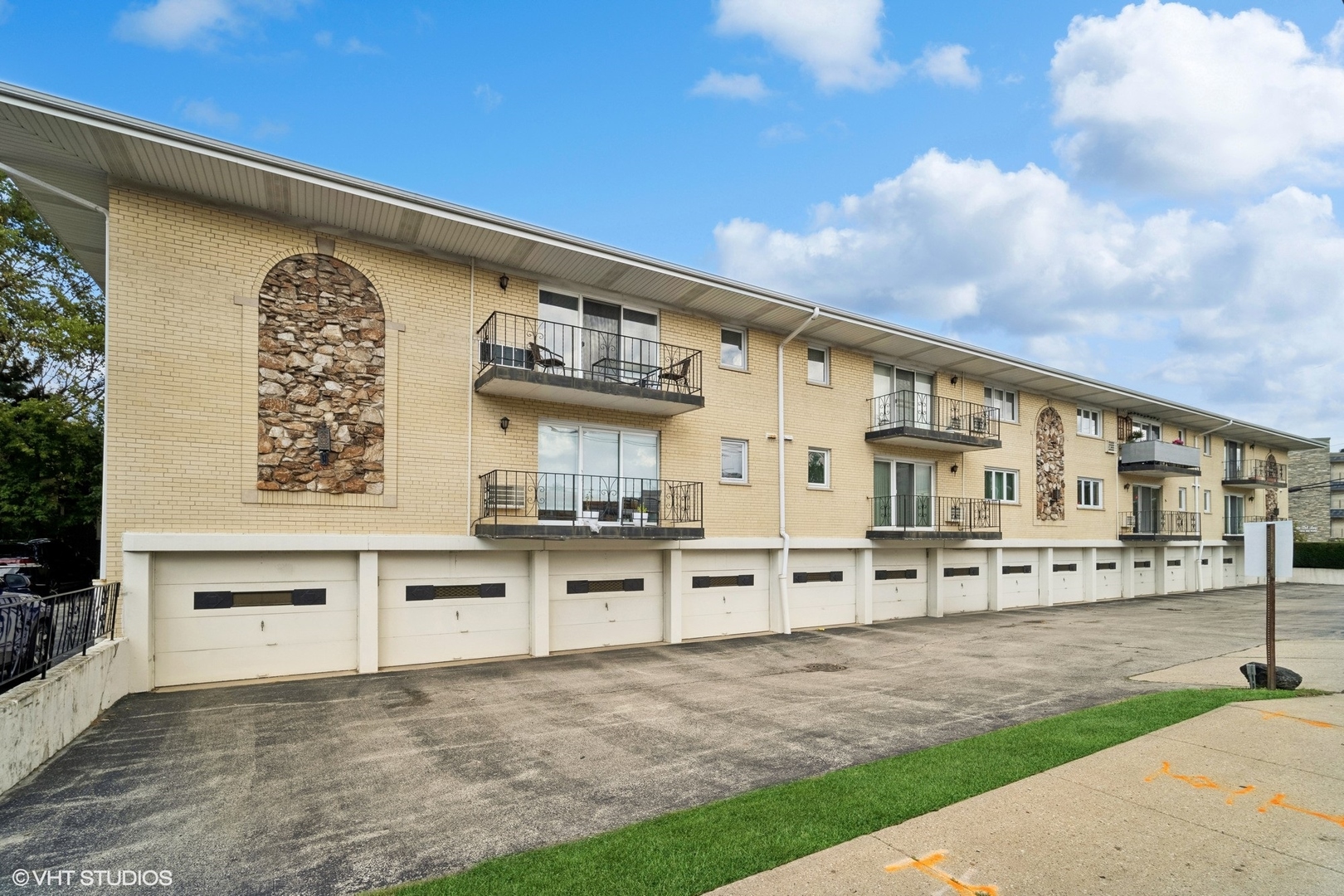 2 North Dee Road, Unit 103 Park Ridge, IL 60068 - Photo 27 of 30 a view of a kitchen with stainless steel appliances granite countertop a stove a sink and a microwave