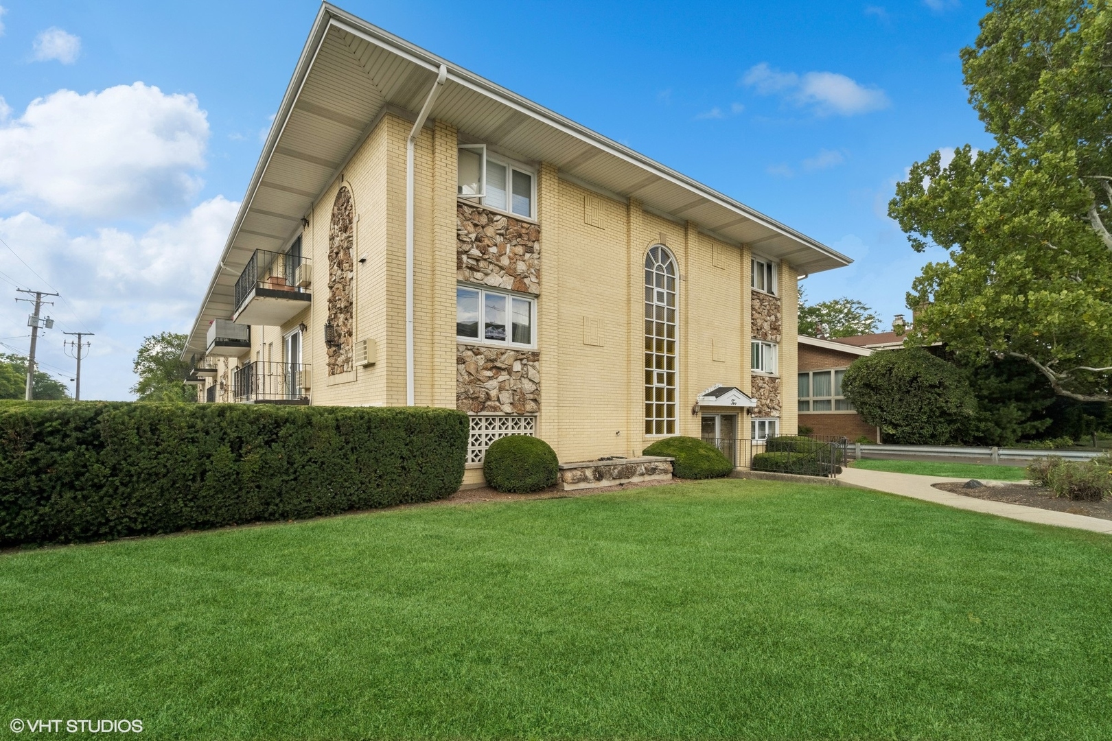 2 North Dee Road, Unit 103 Park Ridge, IL 60068 - Photo 3 of 30 a view of an house with backyard space and garden
