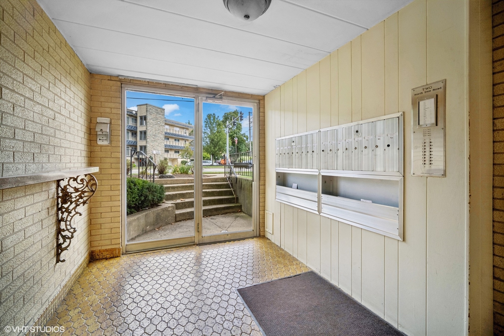 2 North Dee Road, Unit 103 Park Ridge, IL 60068 - Photo 4 of 30 a view of a hallway with wooden floor and windows