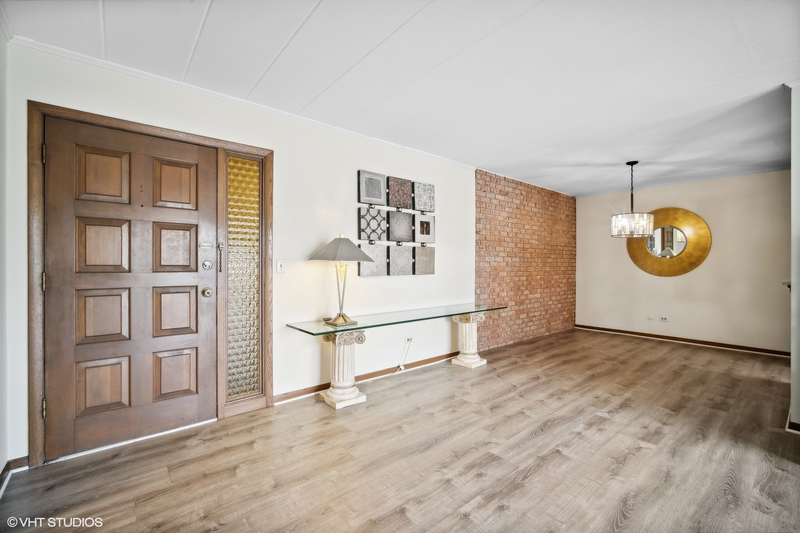 2 North Dee Road, Unit 103 Park Ridge, IL 60068 - Photo 5 of 30 an empty room with windows and pillars in it