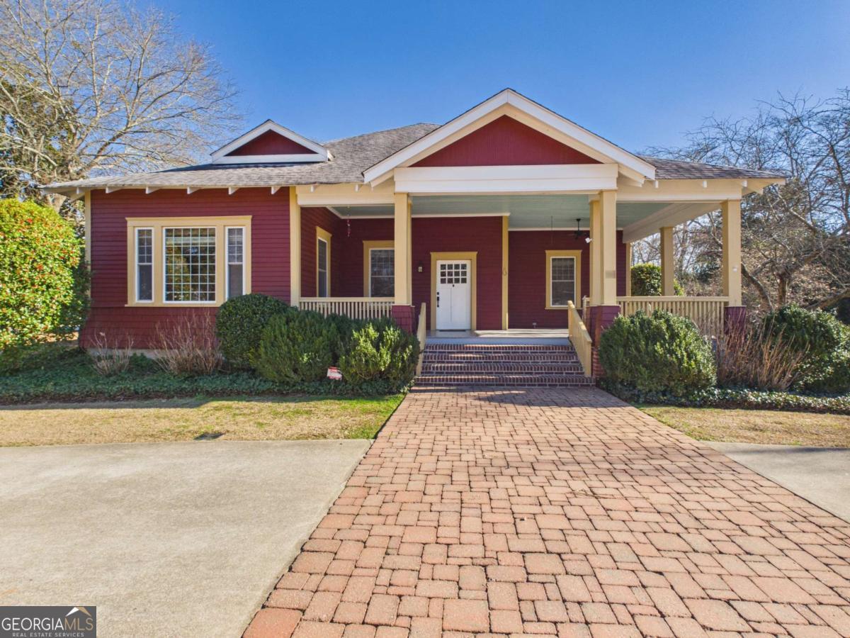 a front view of a house with yard