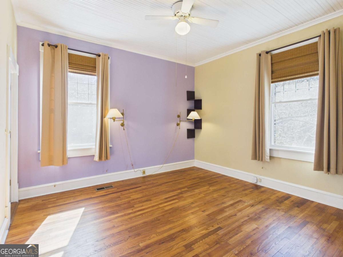 20 Simonton Bridge Road Watkinsville, GA 30677 - Photo 15 of 47 a view of an empty room with window and wooden floor