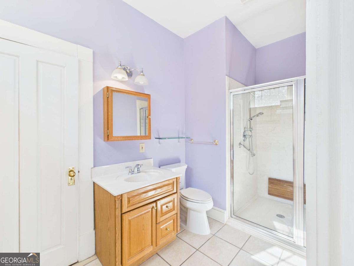 20 Simonton Bridge Road Watkinsville, GA 30677 - Photo 17 of 47 a bathroom with a sink a toilet and shower