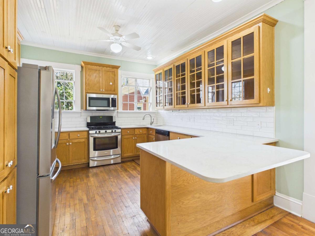 20 Simonton Bridge Road Watkinsville, GA 30677 - Photo 21 of 47 a kitchen that has a sink and a stove top oven