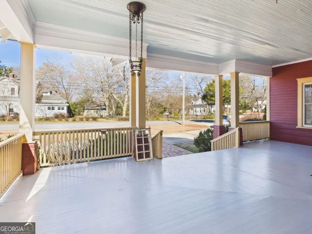 a view of a living room and balcony
