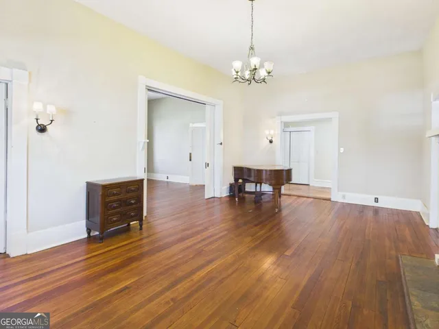 a view of livingroom with furniture wooden floor and front door