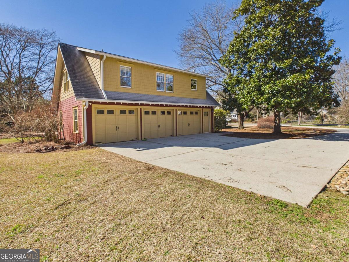 20 Simonton Bridge Road Watkinsville, GA 30677 - Photo 35 of 47 a front view of a house with a yard