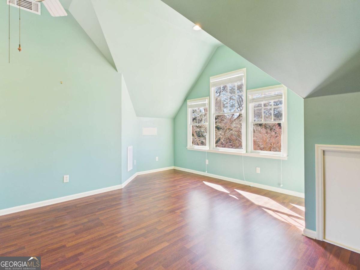 20 Simonton Bridge Road Watkinsville, GA 30677 - Photo 37 of 47 an empty room with wooden floor and windows