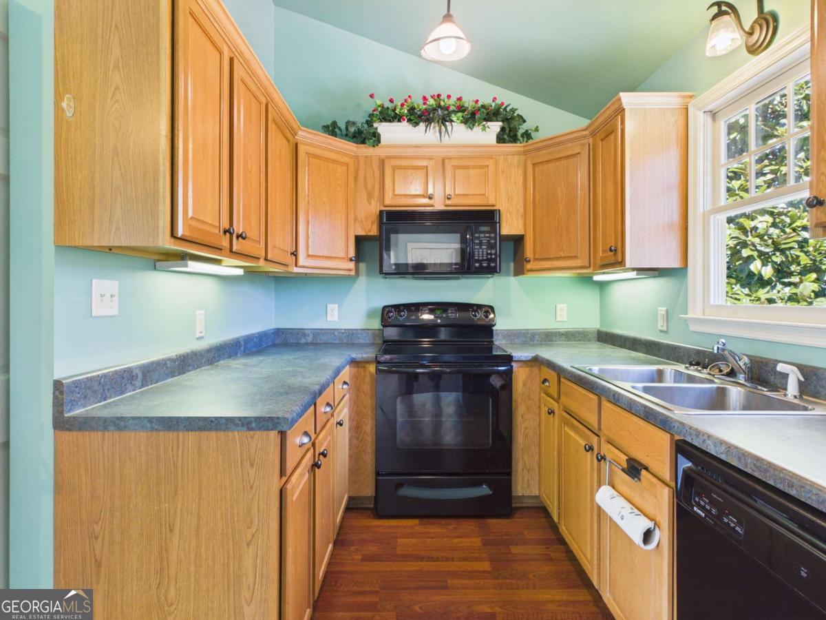 20 Simonton Bridge Road Watkinsville, GA 30677 - Photo 40 of 47 a kitchen with a sink stove and cabinets
