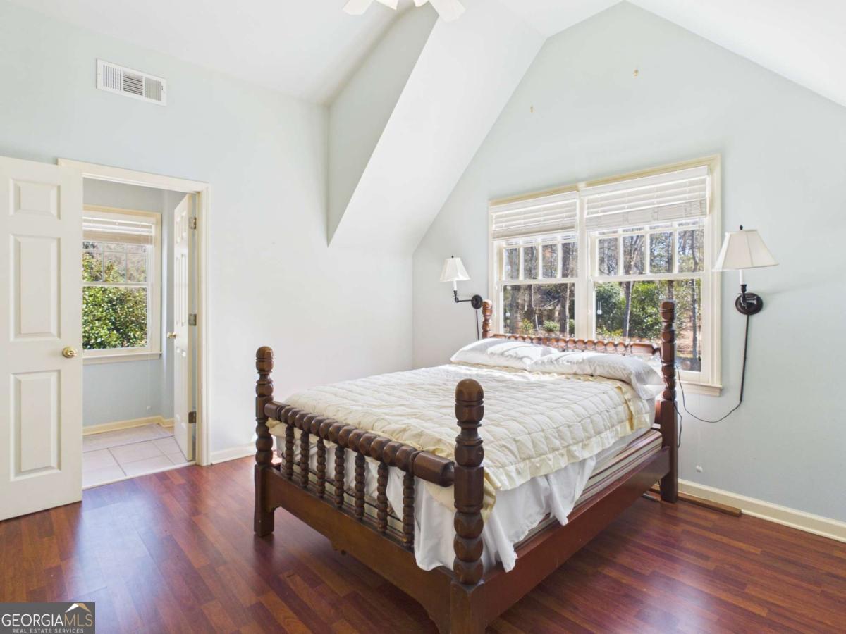 20 Simonton Bridge Road Watkinsville, GA 30677 - Photo 42 of 47 a bedroom with a bed and wooden floor
