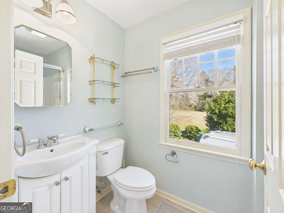 20 Simonton Bridge Road Watkinsville, GA 30677 - Photo 43 of 47 a bathroom with a sink a toilet and a mirror