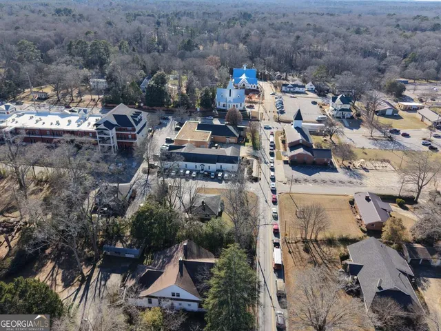 an aerial view of multiple house with parking space