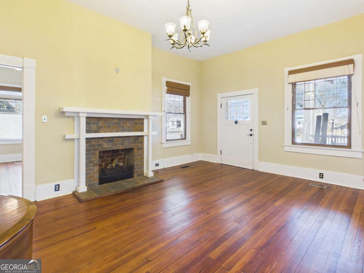 20 Simonton Bridge Road Watkinsville, GA 30677 - Photo 5 of 47 a view of an empty room with window and wooden floor