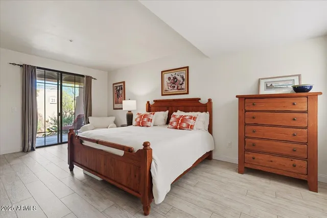 a bedroom with a bed and a dresser