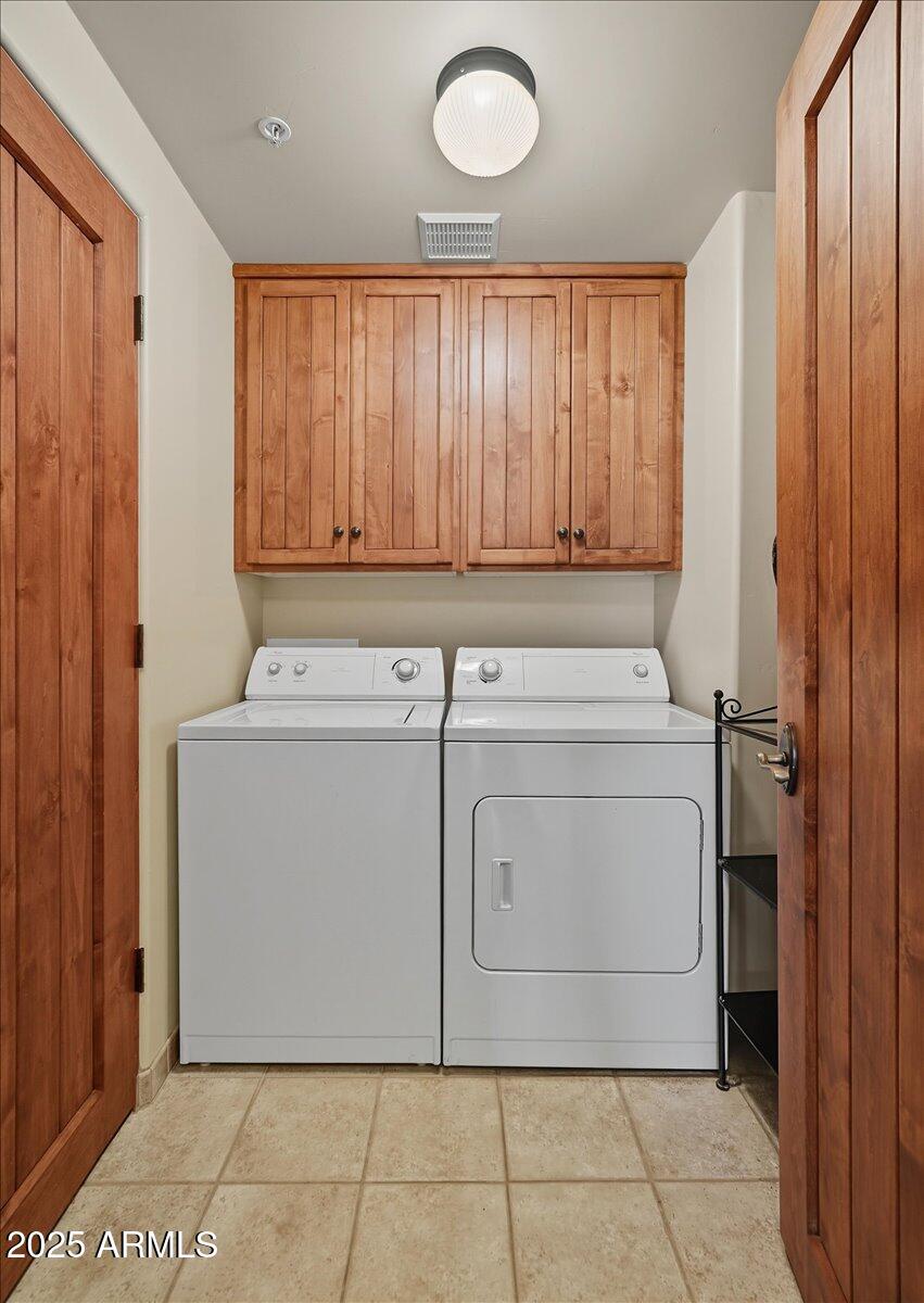 36601 North Mule Train Road, Unit B20 Carefree, AZ 85377 - Photo 20 of 27 a utility room with dryer and washer