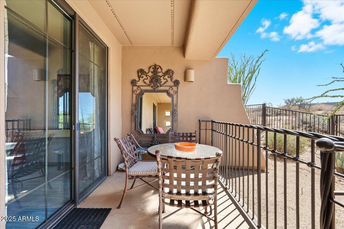 36601 North Mule Train Road, Unit B20 Carefree, AZ 85377 - Photo 23 of 27 a view of a balcony dining area with furniture