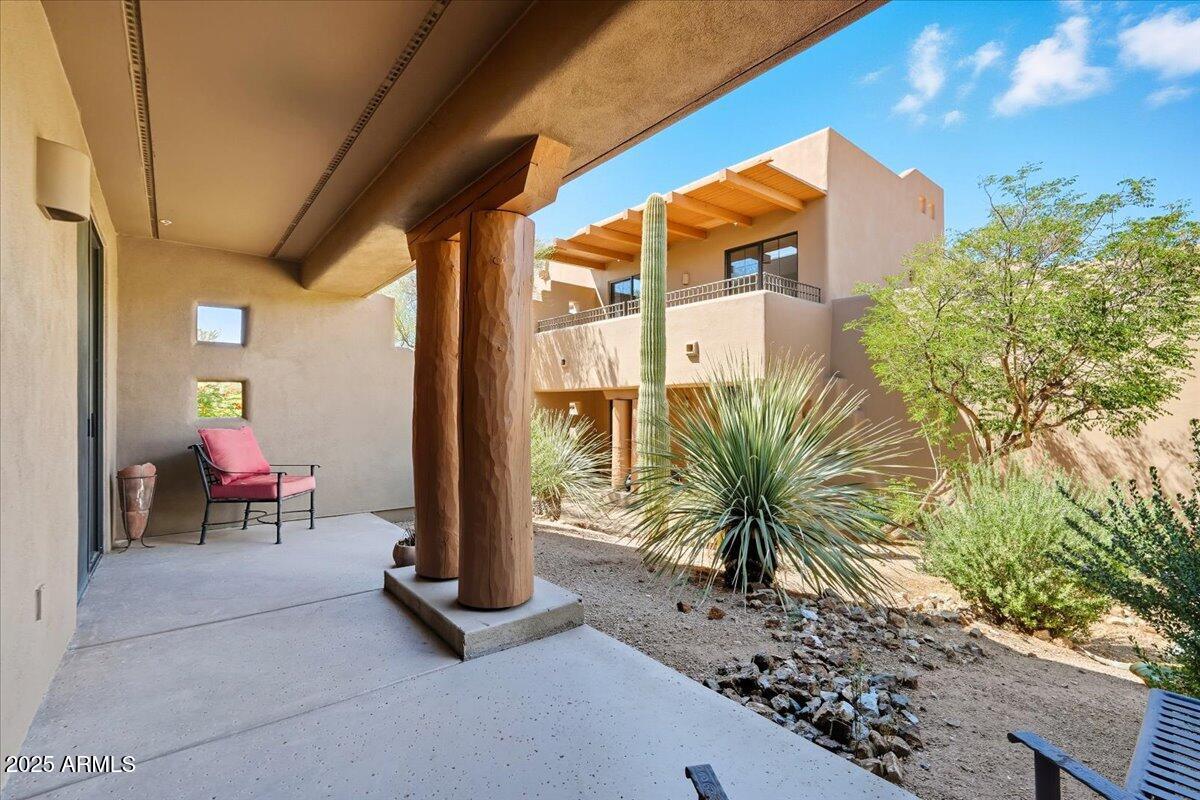 36601 North Mule Train Road, Unit B20 Carefree, AZ 85377 - Photo 25 of 27 a potted plant sitting in front of a building