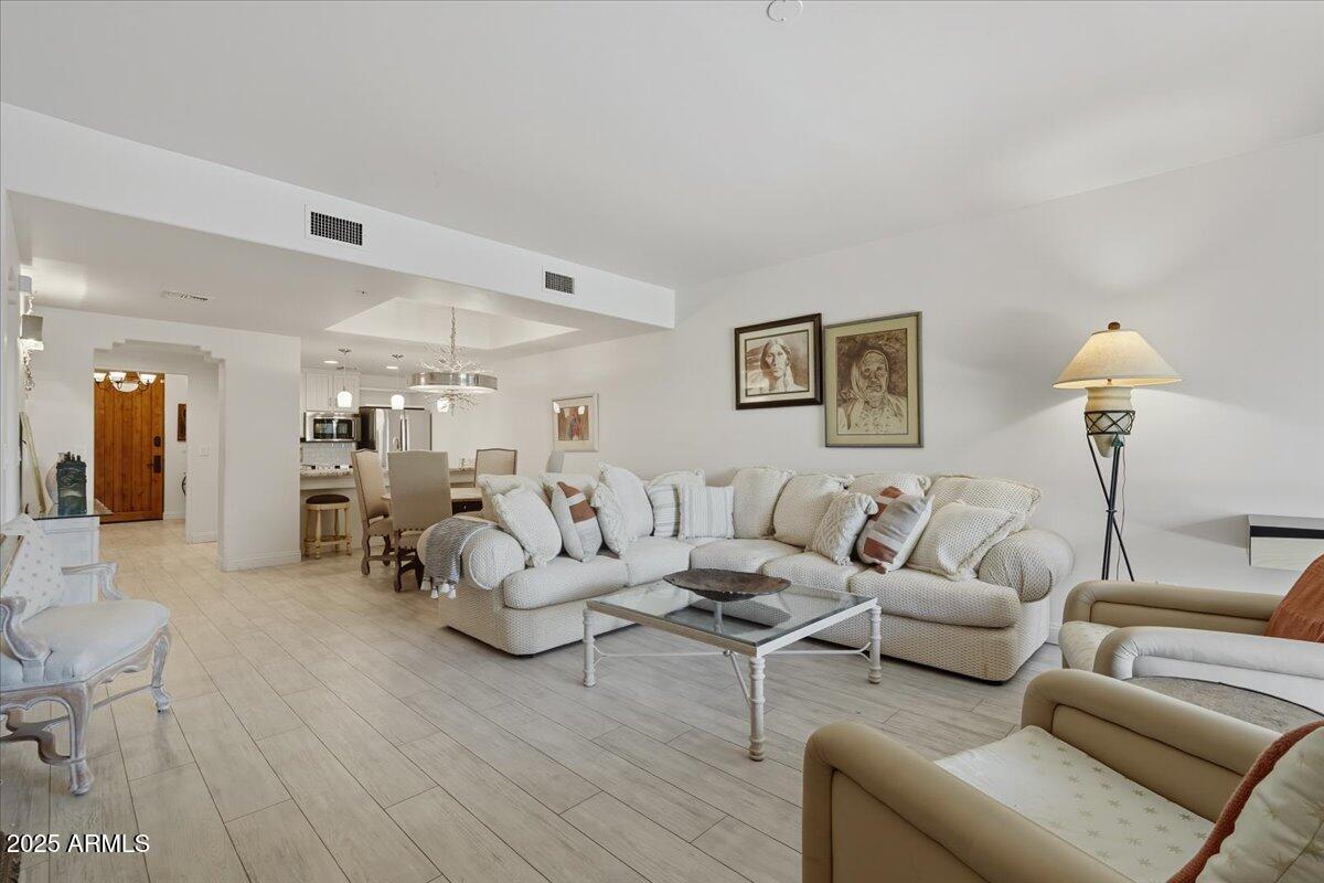 36601 North Mule Train Road, Unit B20 Carefree, AZ 85377 - Photo 5 of 27 a living room with furniture and wooden floor