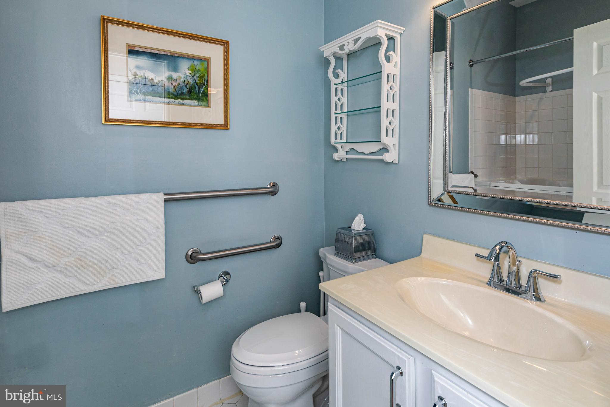 24 Foster Road Pennington, NJ 08534 - Photo 23 of 38 a bathroom with a toilet a sink and mirror