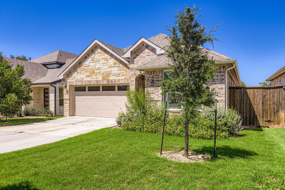 1909 Ruger Pass Leander, TX 78641 - Photo 1 of 1 a view of a house next to a yard