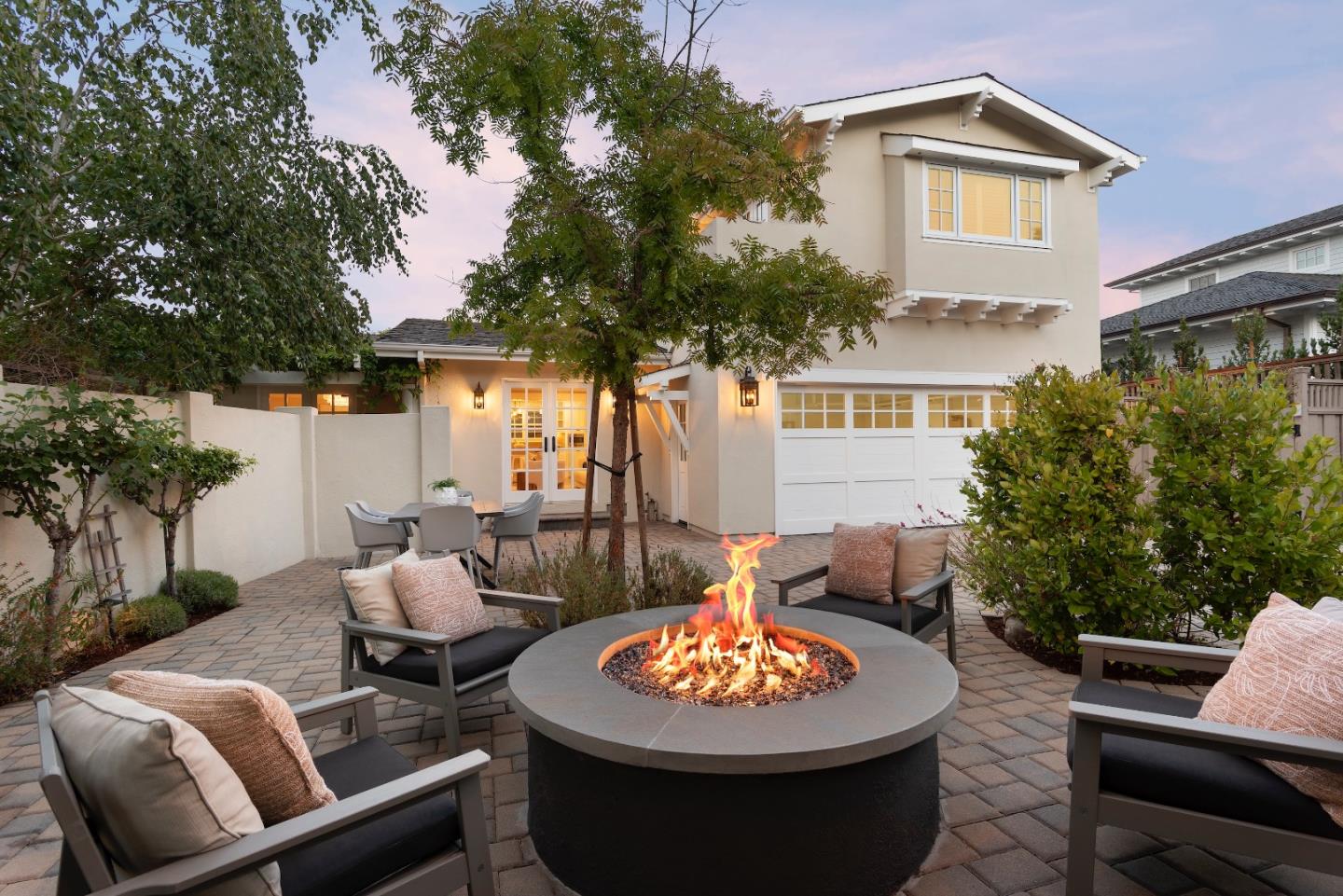 a outdoor space with the couches and a fireplace