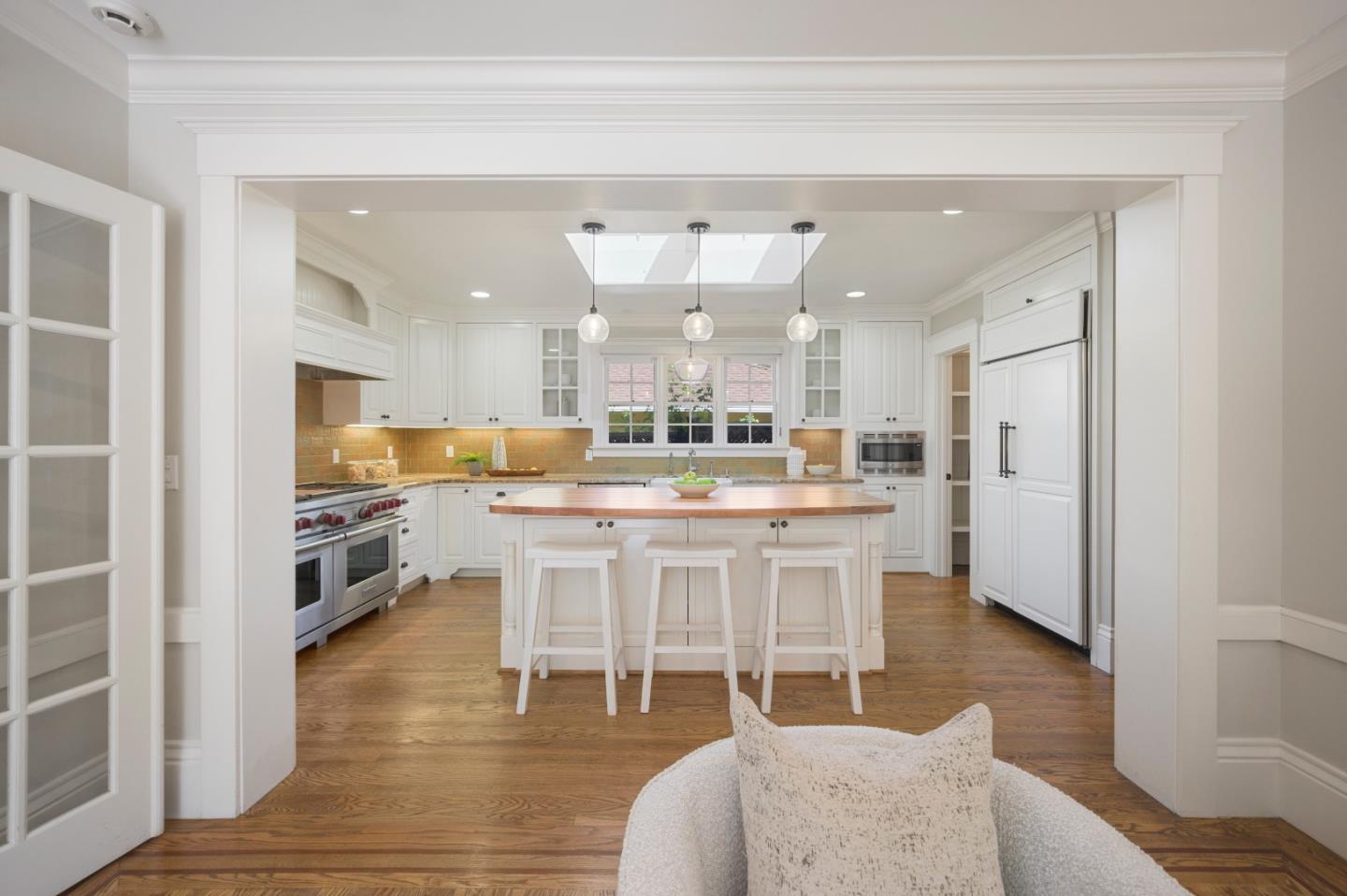 343 Warren Road San Mateo, CA 94402 - Photo 12 of 28 a large kitchen with a table and chairs