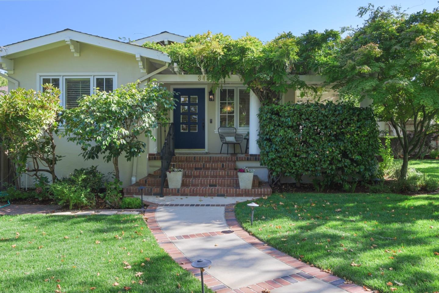343 Warren Road San Mateo, CA 94402 - Photo 3 of 28 a front view of a house with garden